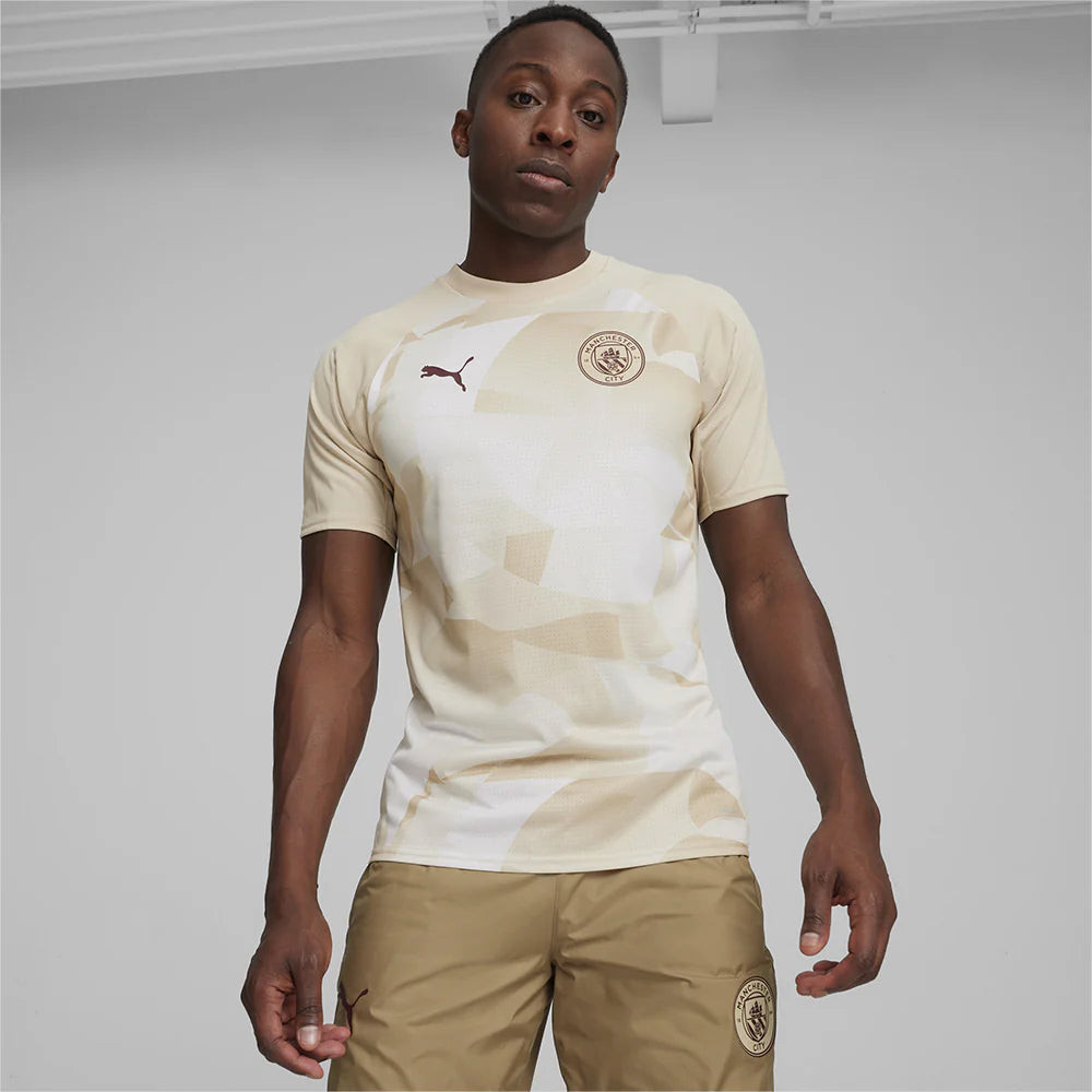 Áo đấu nam Puma Manchester City Pre-Match màu xanh ngọc, thể hiện sự hợp tác giữa Puma và câu lạc bộ
