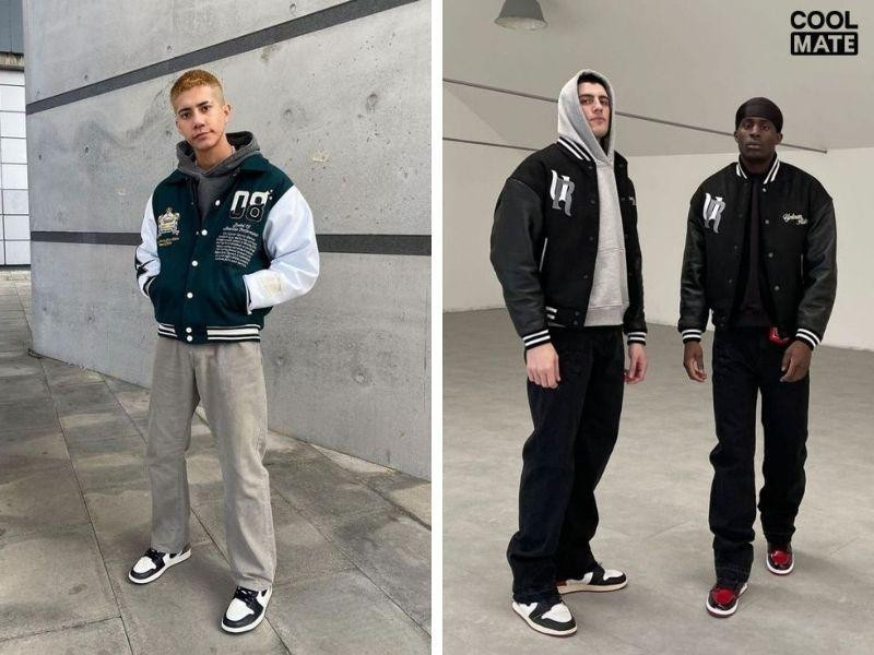 Chàng trai phong cách với varsity jacket, quần jean xanh và giày Jordan nam trắng đỏ, tạo nên outfit phối đồ năng động, đậm chất học đường