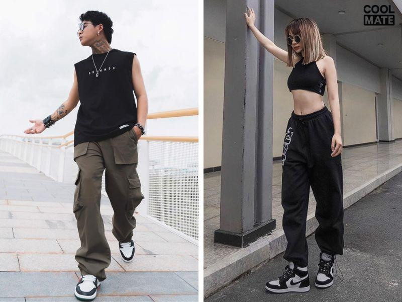 Chàng trai với áo tanktop đen khoe cơ bắp, quần short và giày Jordan nam cổ cao, tạo phong cách phối đồ mạnh mẽ, năng động