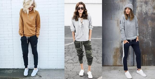 Cô gái diện áo nỉ màu đen, quần joggers đen và giày thể thao trắng
