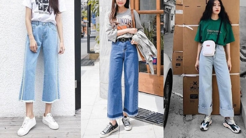 Cô gái thanh lịch với quần ống loe đen, áo sơ mi trắng và giày thể thao độn đế màu trắng, tạo phong cách công sở hiện đại