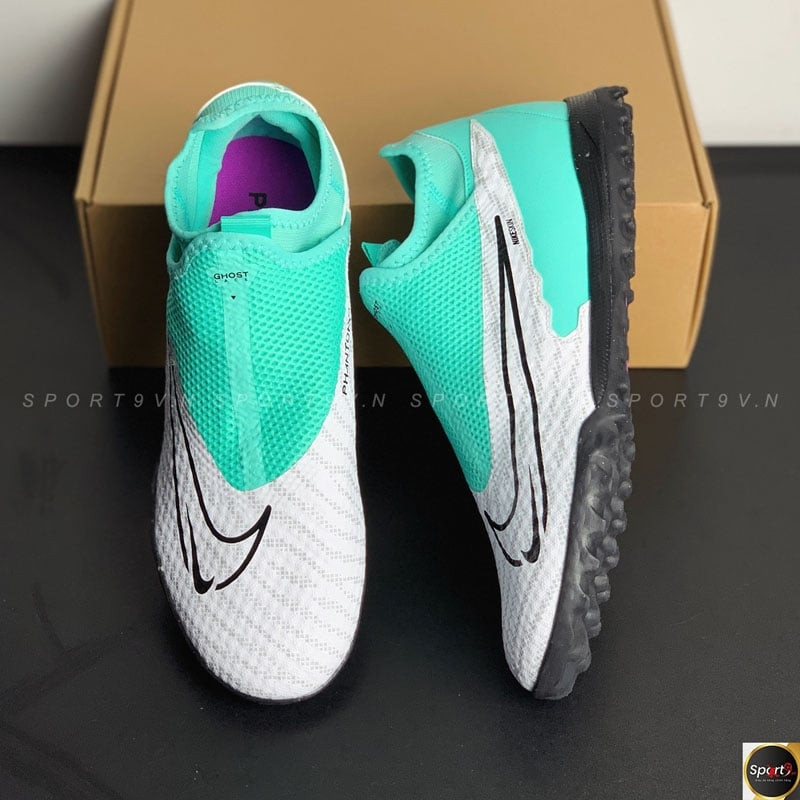 Giày đá bóng Nike Phantom Academy DF TF màu xanh nổi bật, thiết kế dấu dây Ghost Lace tăng cường kiểm soát bóng.