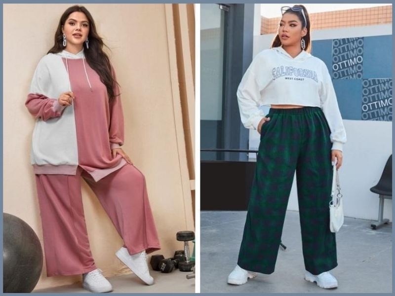 Cô gái dáng đầy đặn mặc quần ống rộng màu đen với áo hoodie crop top màu xám, phong cách street style năng động.