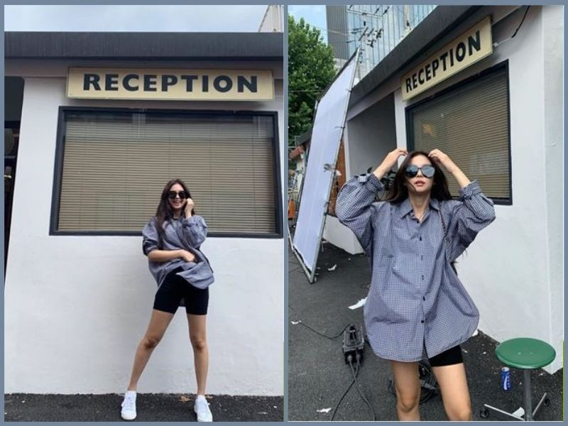 Nữ phối áo sơ mi màu be dáng rộng khoác ngoài áo hai dây trắng cùng quần short denim